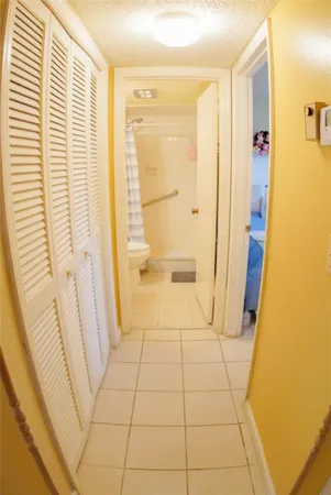 a bathroom with a sink a toilet and a shower