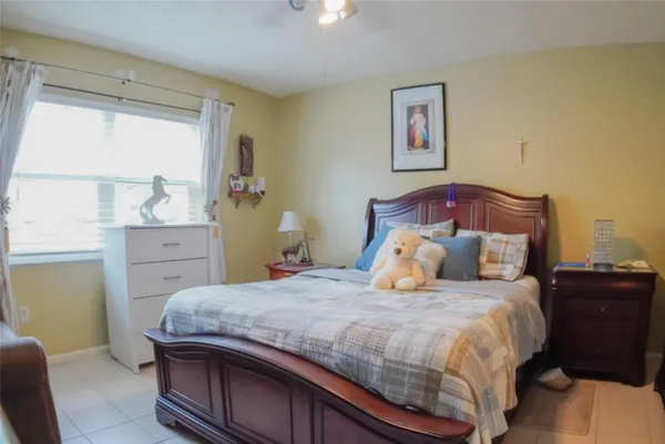 a bedroom with a bed and a cabinets