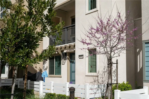 front view of a house with a tree