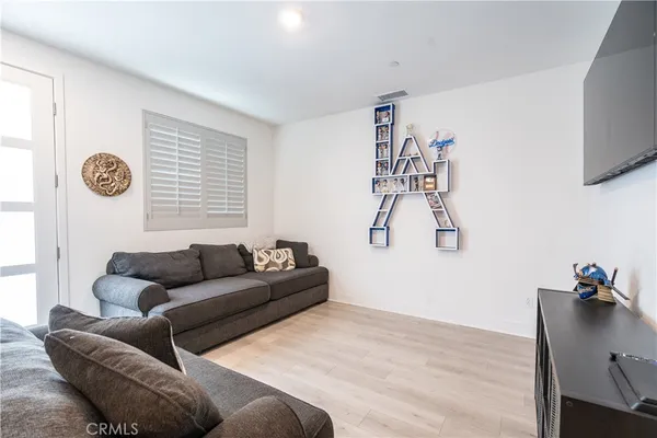 a living room with furniture and a window