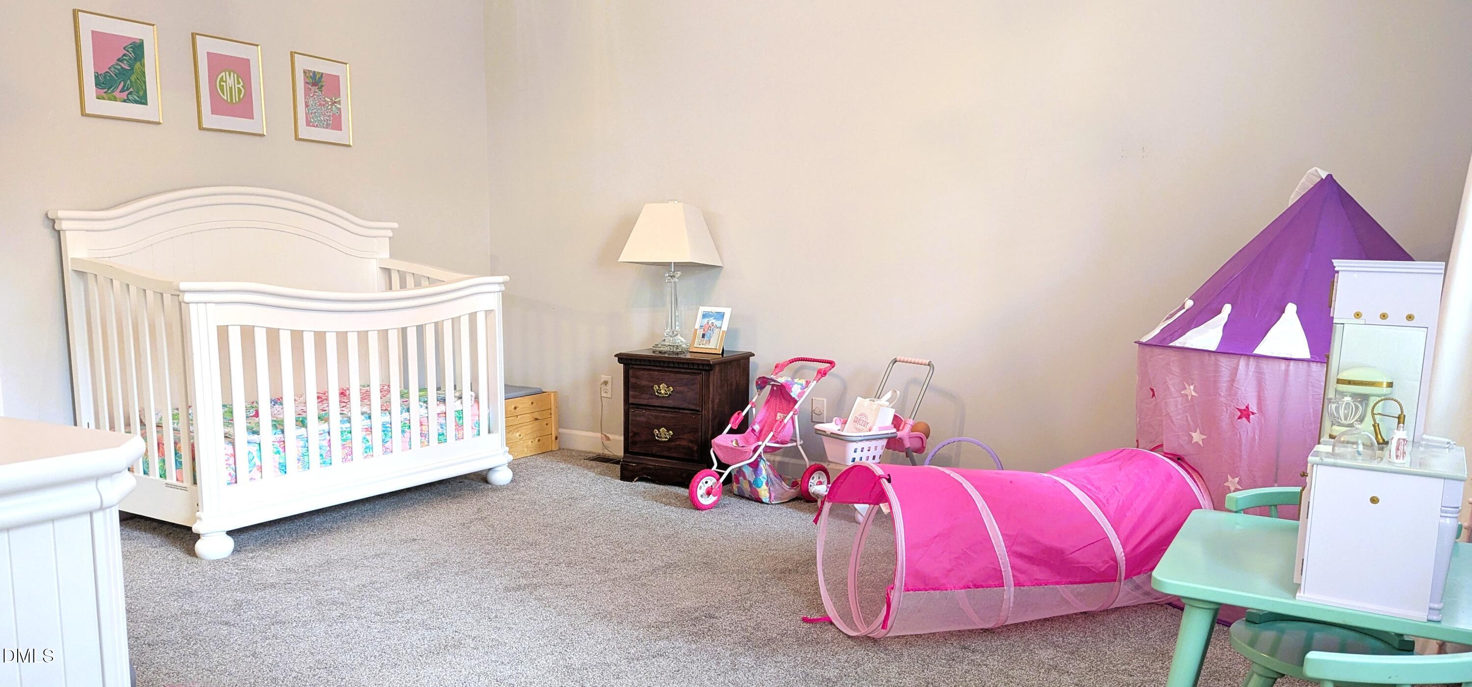 540 Weathergreen Drive Raleigh, NC 27615 - Photo 11 of 20 a bedroom with furniture and a window