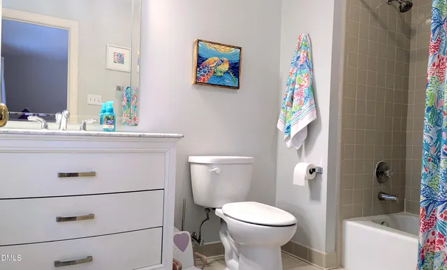 a bathroom with a sink a toilet and a tub