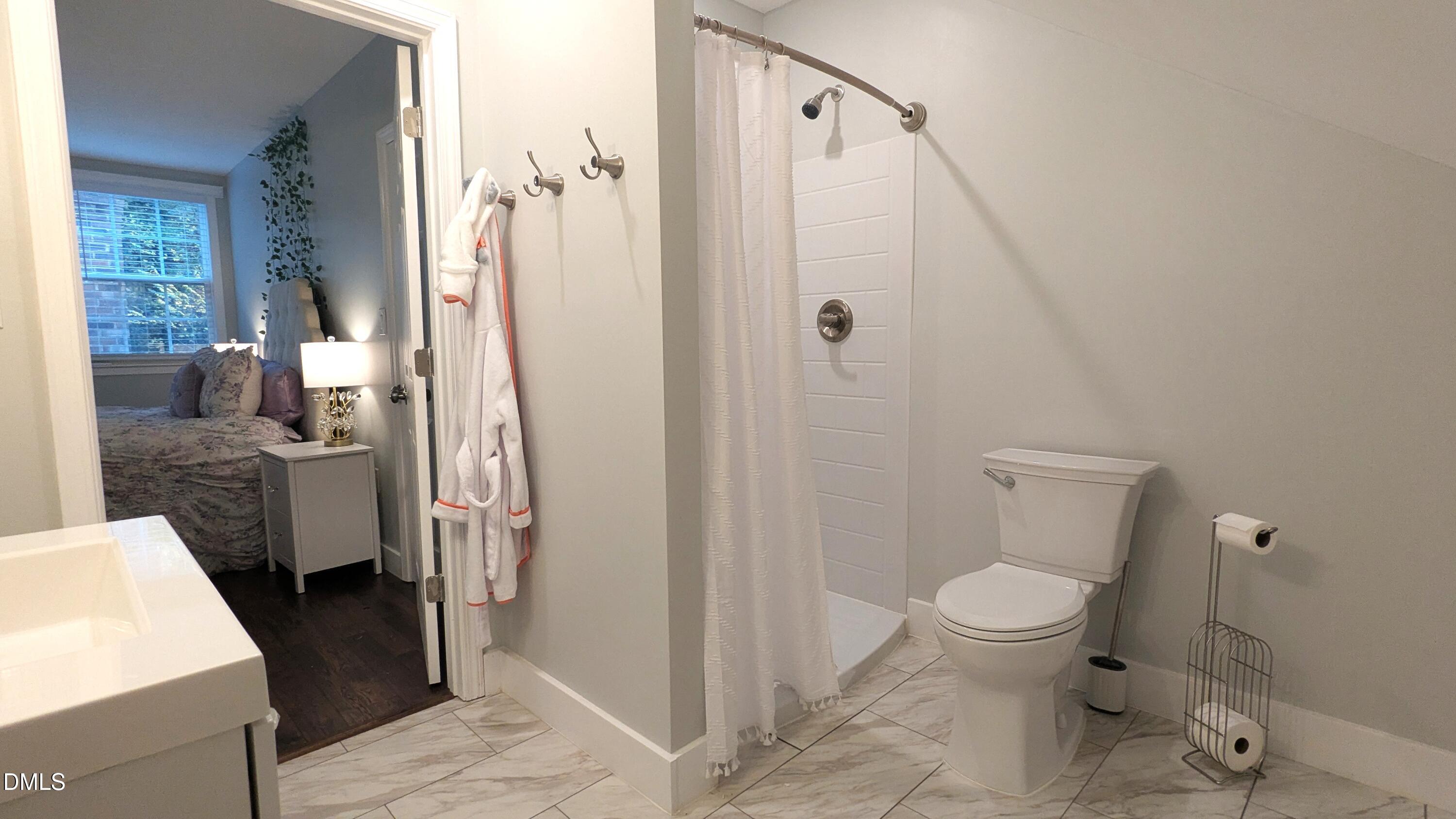 540 Weathergreen Drive Raleigh, NC 27615 - Photo 19 of 20 a bathroom with a sink toilet and shower