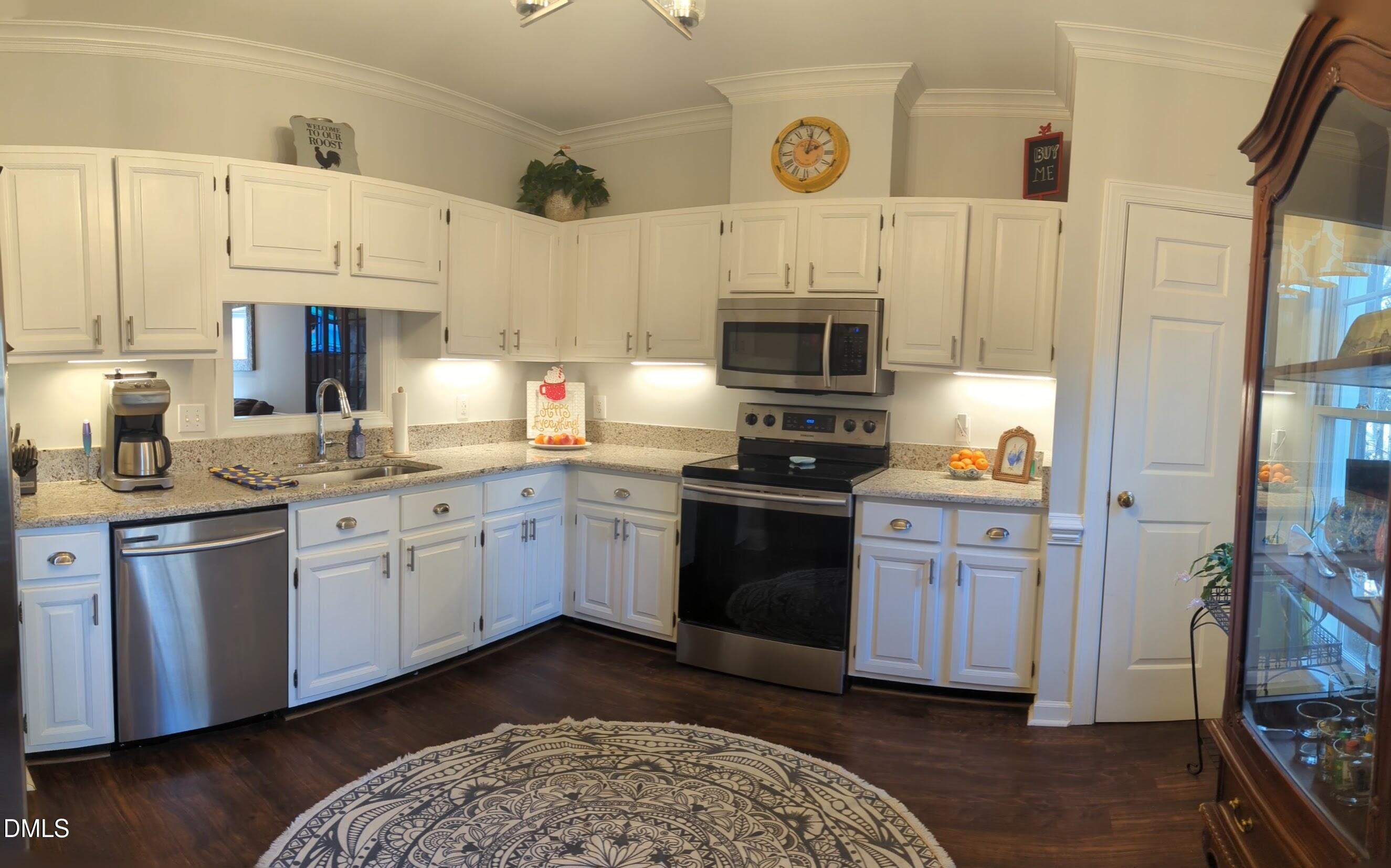 540 Weathergreen Drive Raleigh, NC 27615 - Photo 6 of 20 a kitchen with stainless steel appliances granite countertop a refrigerator a stove top oven a sink and dishwasher