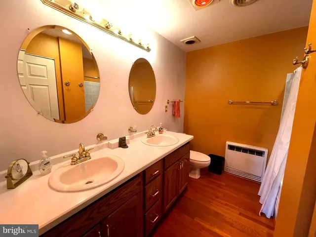 a bathroom with a tub and a shower