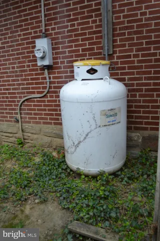 a view of a door and brick wall