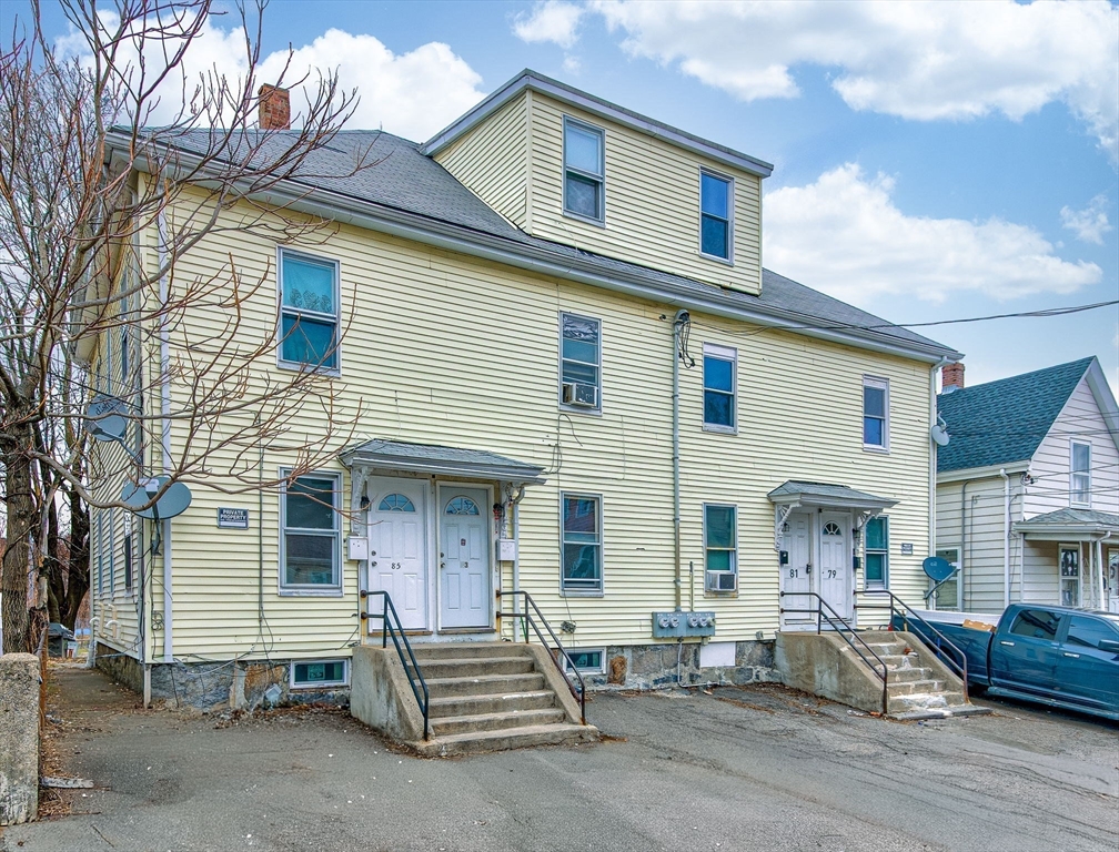 79 Gilbert Street Quincy, MA 02169 - Photo 1 of 38 a front view of a house with a yard and seating space