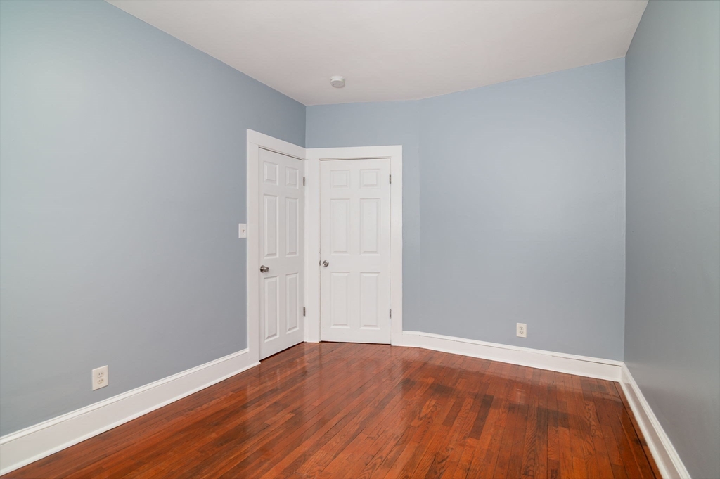 79 Gilbert Street Quincy, MA 02169 - Photo 15 of 38 a view of an empty room with wooden floor
