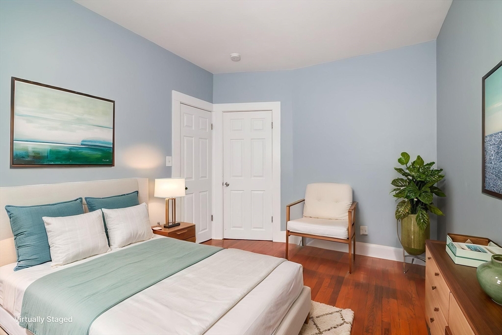 79 Gilbert Street Quincy, MA 02169 - Photo 16 of 38 a bedroom with a bed and a potted plant