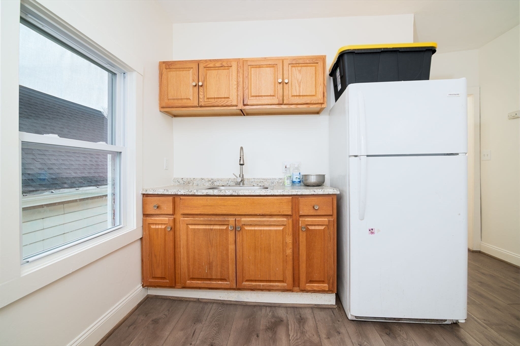 79 Gilbert Street Quincy, MA 02169 - Photo 21 of 38 a white refrigerator freezer sitting inside of a kitchen