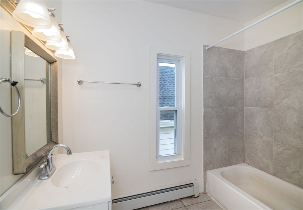 79 Gilbert Street Quincy, MA 02169 - Photo 22 of 38 a bathroom with a sink and a bathtub