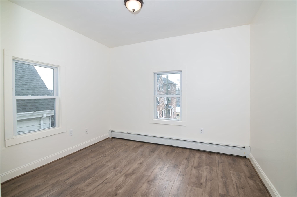 79 Gilbert Street Quincy, MA 02169 - Photo 24 of 38 an empty room with a window
