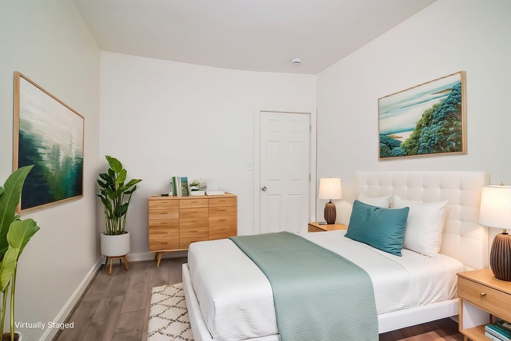 79 Gilbert Street Quincy, MA 02169 - Photo 28 of 38 a bedroom with a bed and a potted plant