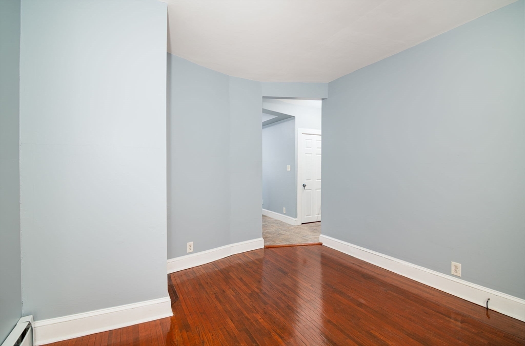 79 Gilbert Street Quincy, MA 02169 - Photo 3 of 38 a view of room with wooden floor