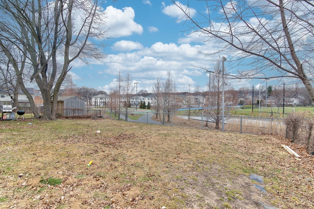 79 Gilbert Street Quincy, MA 02169 - Photo 31 of 38 a view of backyard with large trees