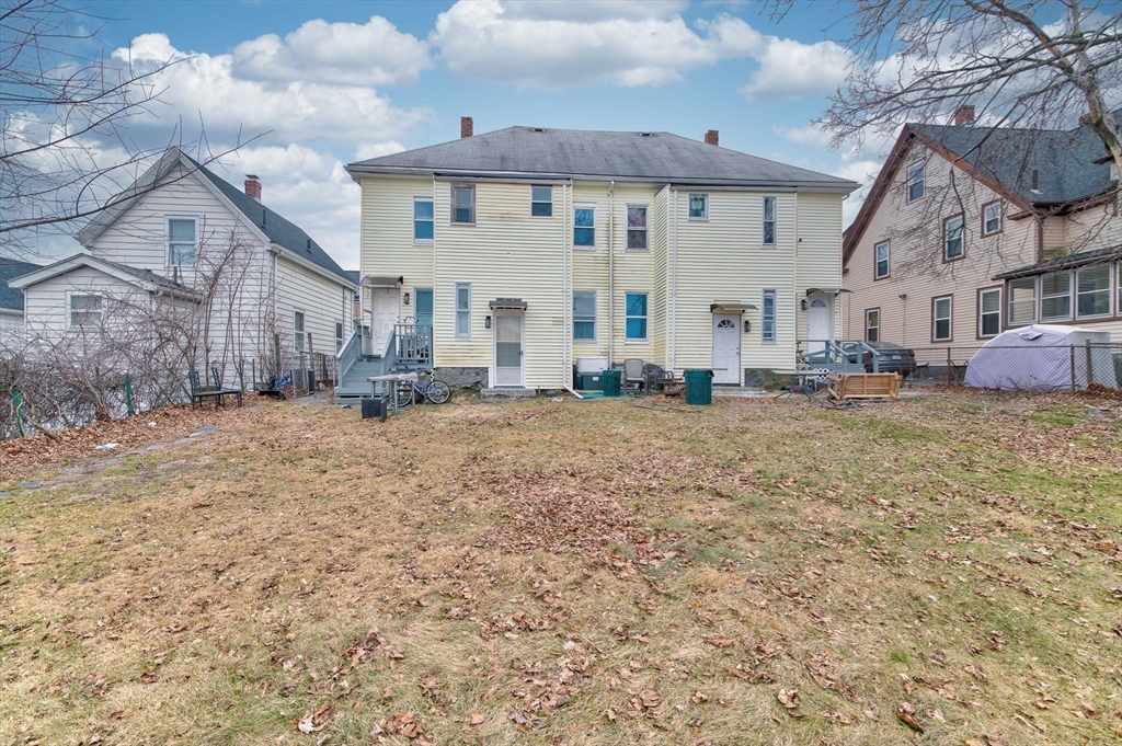 79 Gilbert Street Quincy, MA 02169 - Photo 34 of 38 a view of a big house with a big yard and large trees