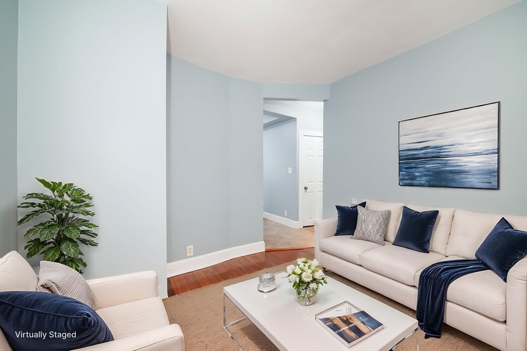 79 Gilbert Street Quincy, MA 02169 - Photo 4 of 38 a living room with furniture and a potted plant