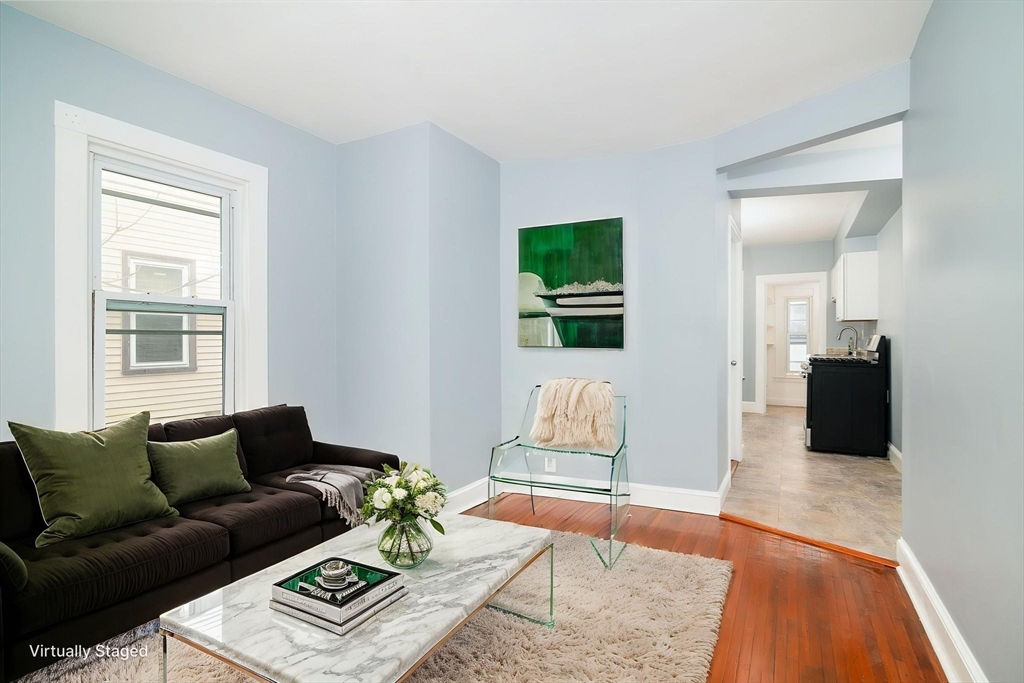 79 Gilbert Street Quincy, MA 02169 - Photo 6 of 38 a living room with furniture and a rug