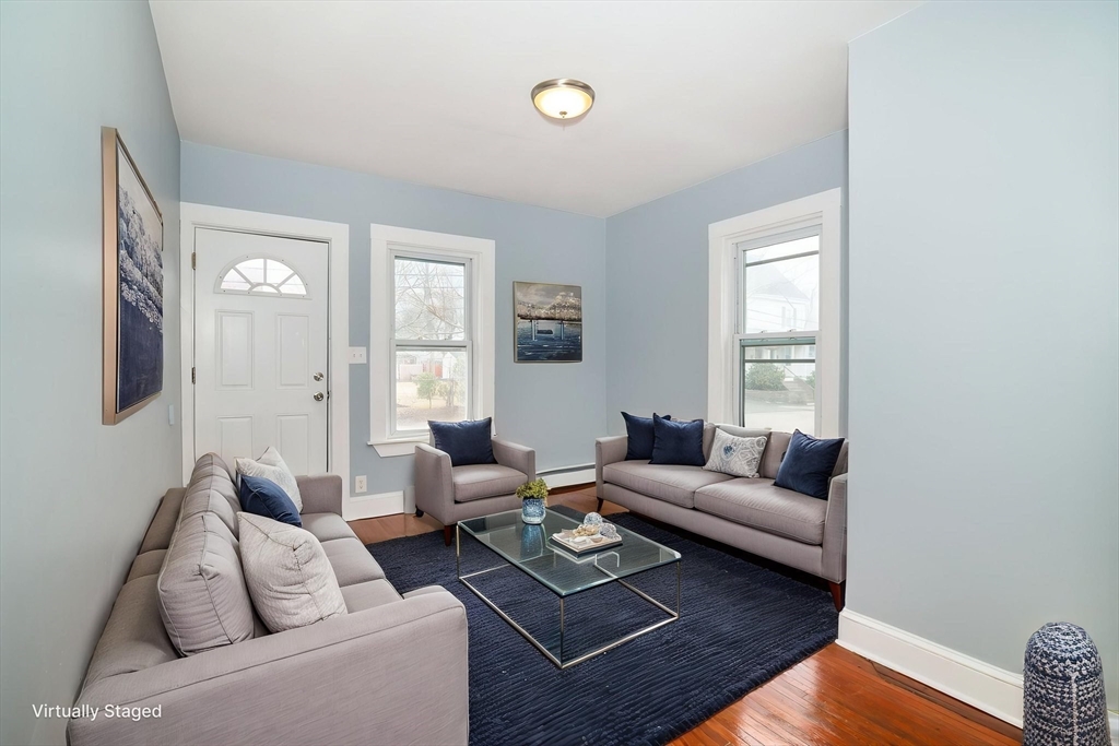 79 Gilbert Street Quincy, MA 02169 - Photo 8 of 38 a living room with furniture and a window