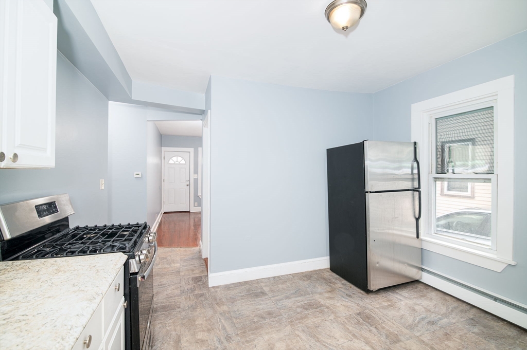 79 Gilbert Street Quincy, MA 02169 - Photo 10 of 38 a view of a kitchen cabinets and a refrigerator