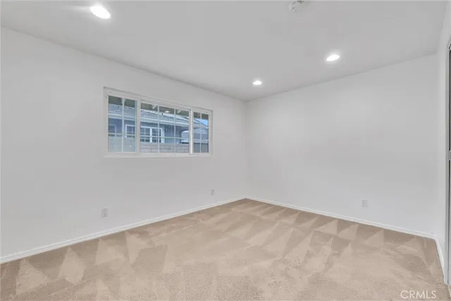 an empty room with a windows