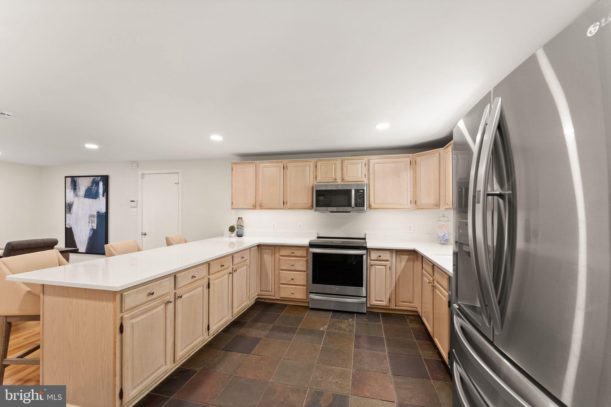 38620 Lime Kiln Road Leesburg, VA 20175 - Photo 42 of 87 a kitchen with stainless steel appliances a sink stove refrigerator and cabinets
