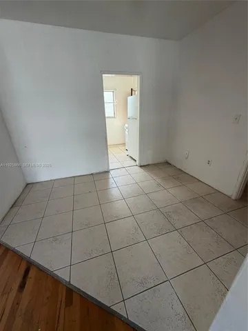 a view of an empty room and windows