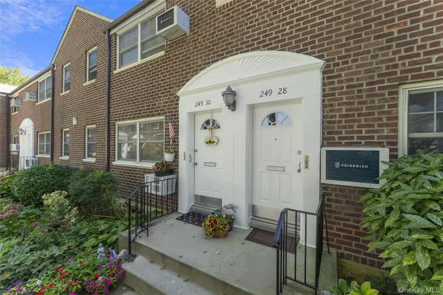 a front view of a house with outdoor seating