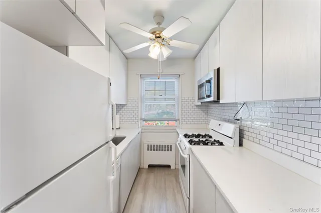a kitchen with a refrigerator a sink and dishwasher