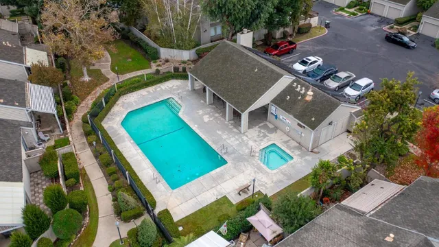 an aerial view of a house with a swimming pool