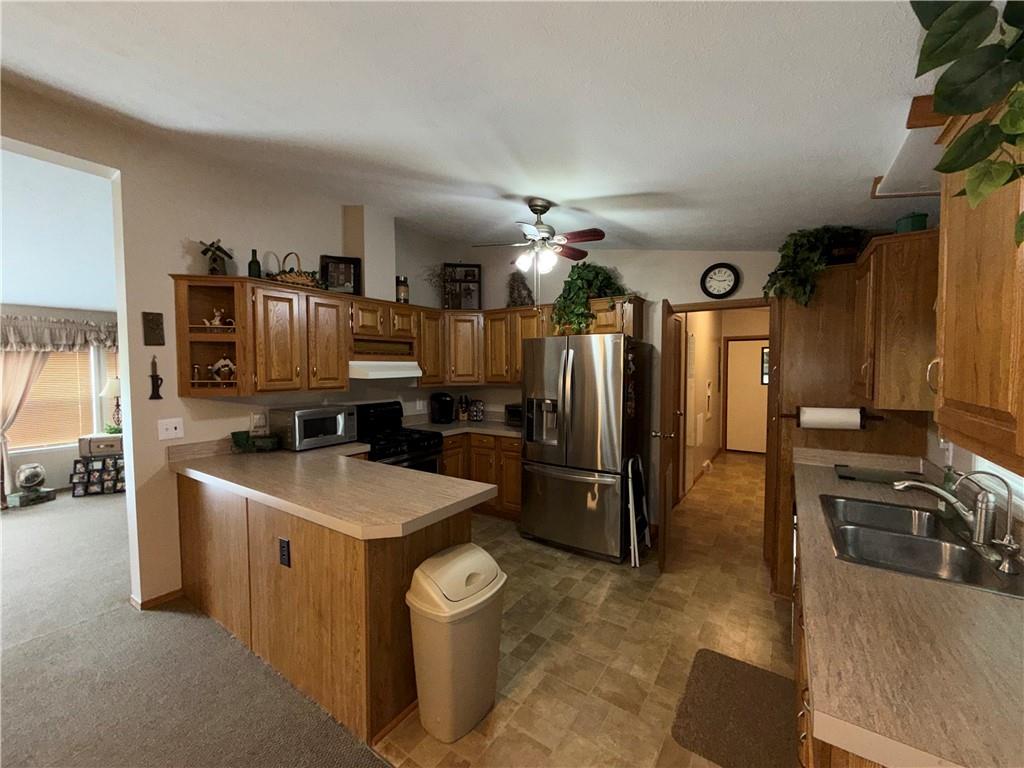 1881 Westford Road Jamestown, PA 16134 - Photo 18 of 50 a kitchen with stainless steel appliances granite countertop a sink a stove and a refrigerator