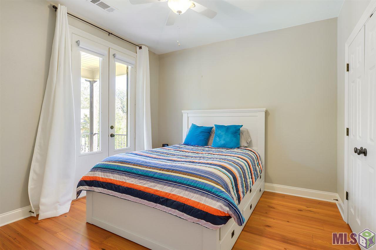 3738 Woodland Ridge Boulevard Baton Rouge, LA 70816 - Photo 10 of 16 Guest bedroom overlooking balcony.