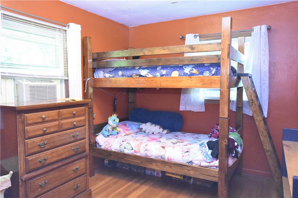 983 Mercer Grove City Road Mercer, PA 16137 - Photo 11 of 19 a bed sitting in a bedroom next to a window