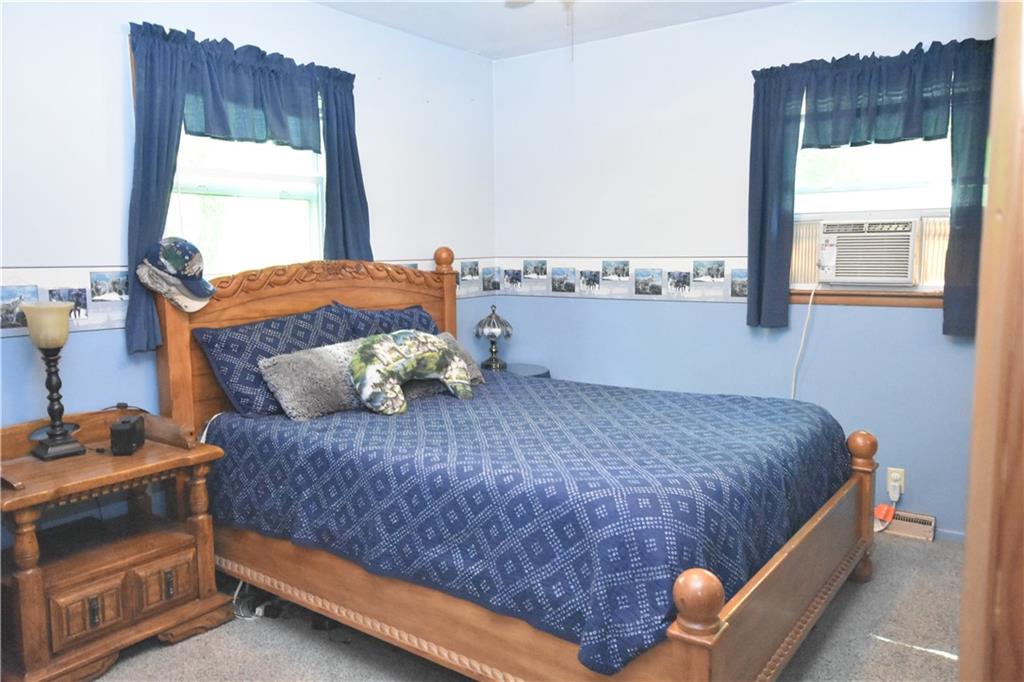 983 Mercer Grove City Road Mercer, PA 16137 - Photo 8 of 19 a bedroom with a bed and window