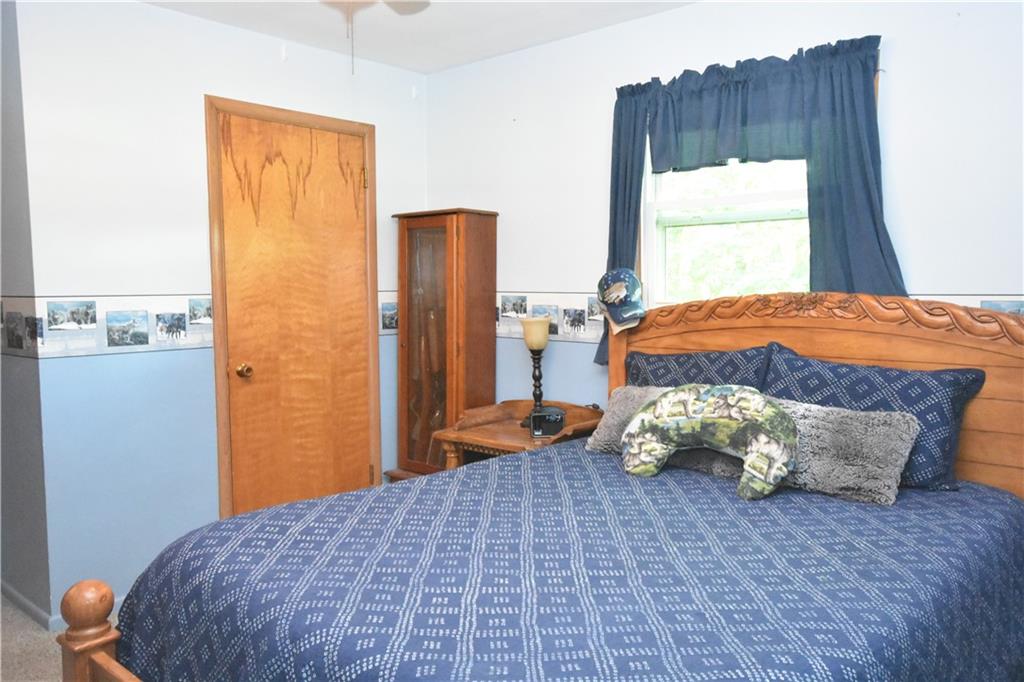 983 Mercer Grove City Road Mercer, PA 16137 - Photo 9 of 19 a bedroom with a bed and window