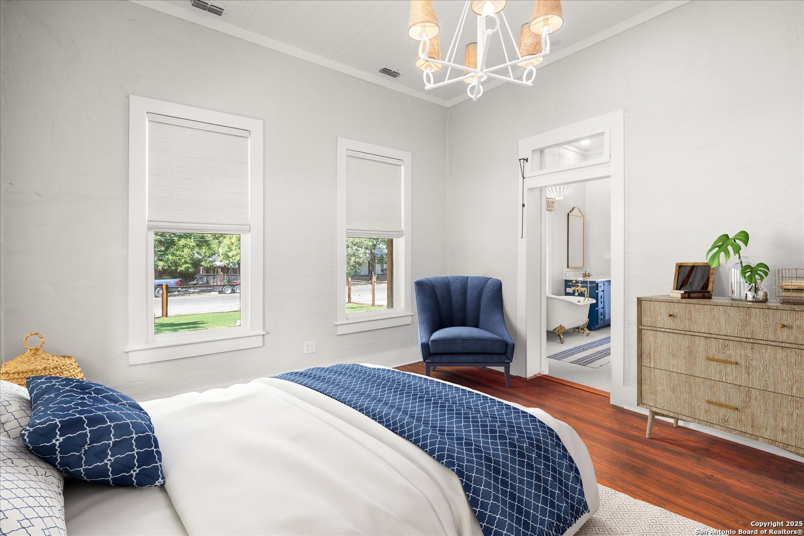 504 6th Street Comfort, TX 78013 - Photo 19 of 48 a bedroom with a large bed and a window