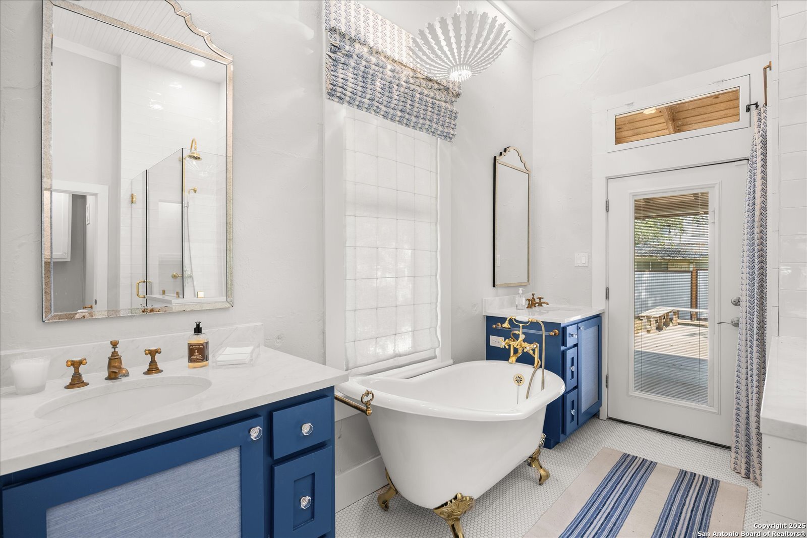 504 6th Street Comfort, TX 78013 - Photo 21 of 48 a bathroom with a tub sink and mirror