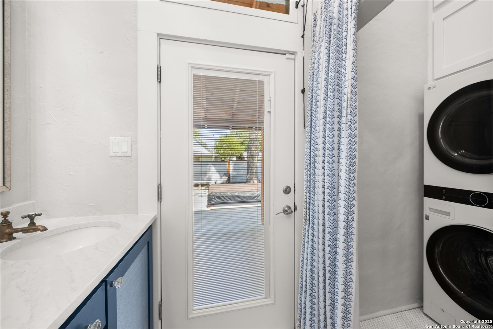 504 6th Street Comfort, TX 78013 - Photo 22 of 48 a bathroom with a sink and a washer dryer