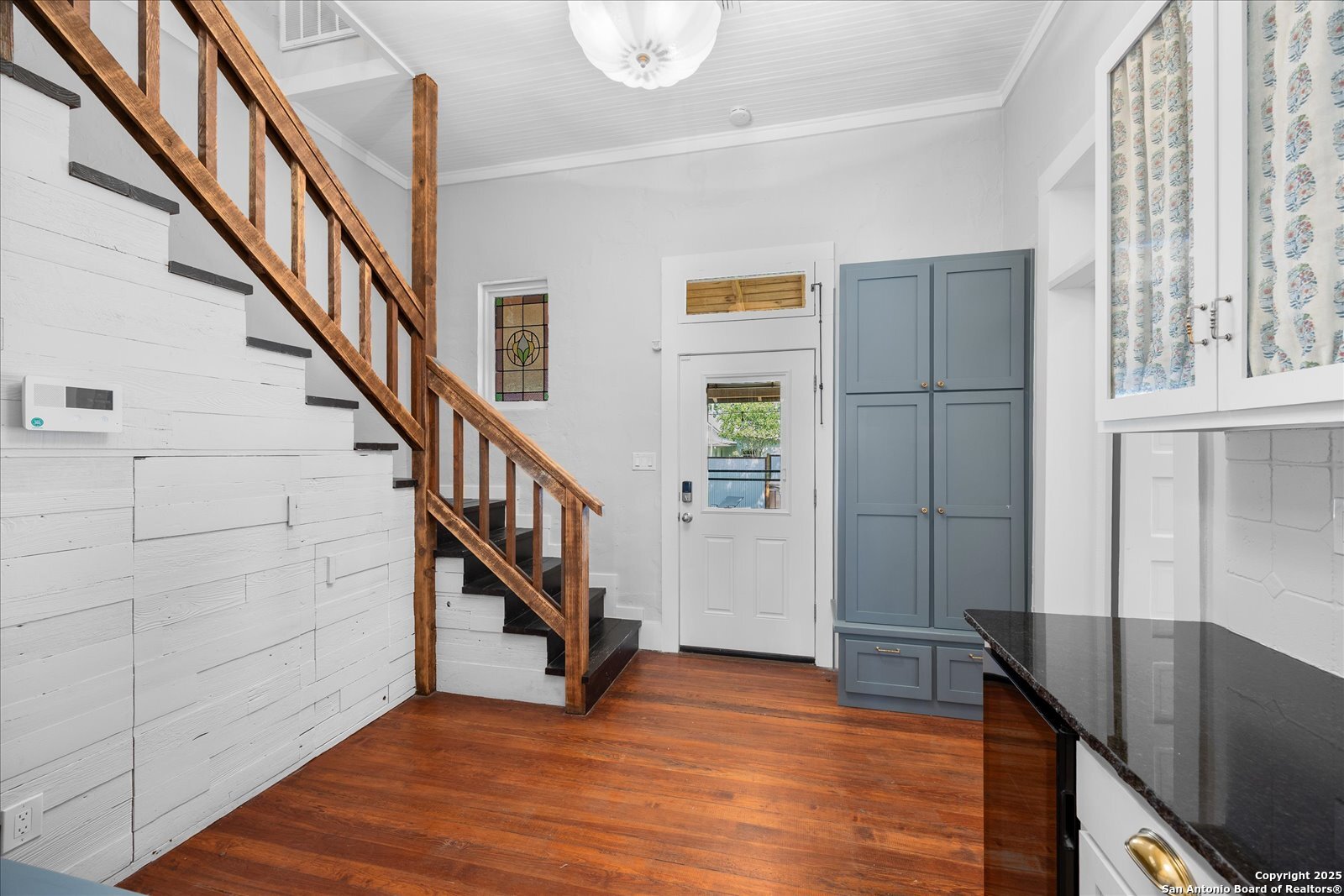 504 6th Street Comfort, TX 78013 - Photo 24 of 48 a view of entryway with wooden floor and stairs