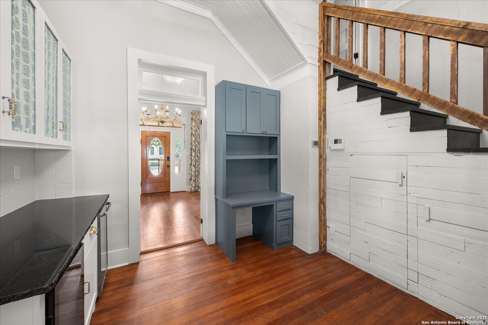 504 6th Street Comfort, TX 78013 - Photo 25 of 48 a view of a livingroom with wooden floor and staircase