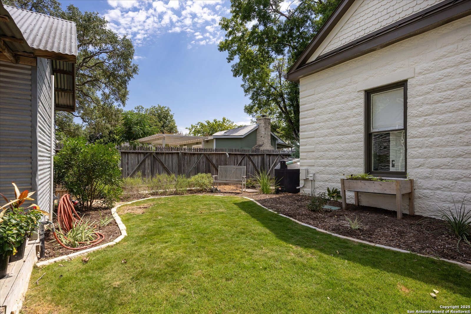 504 6th Street Comfort, TX 78013 - Photo 44 of 48 a view of a house with backyard and sitting area