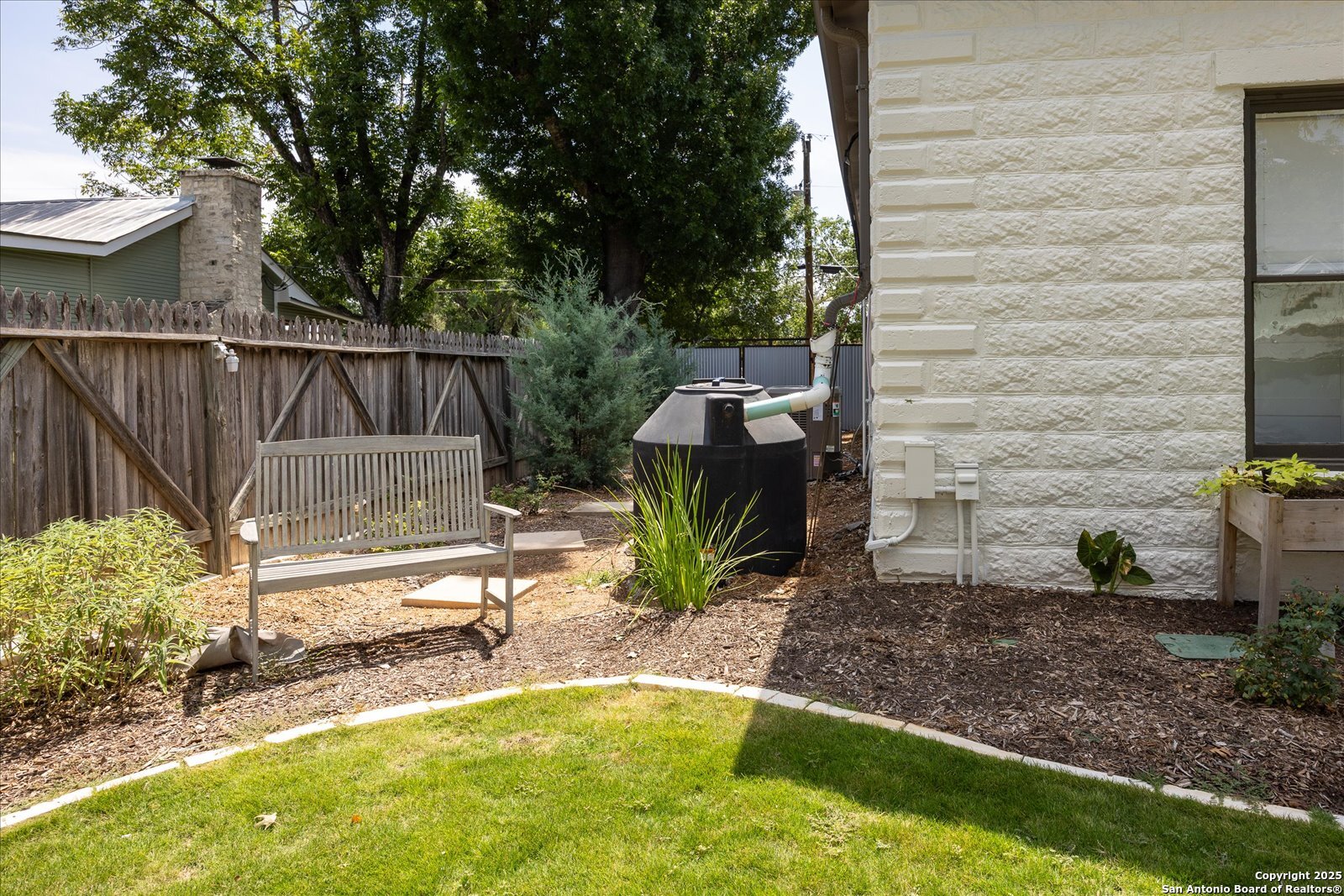 504 6th Street Comfort, TX 78013 - Photo 45 of 48 a view of a backyard with plants and a patio