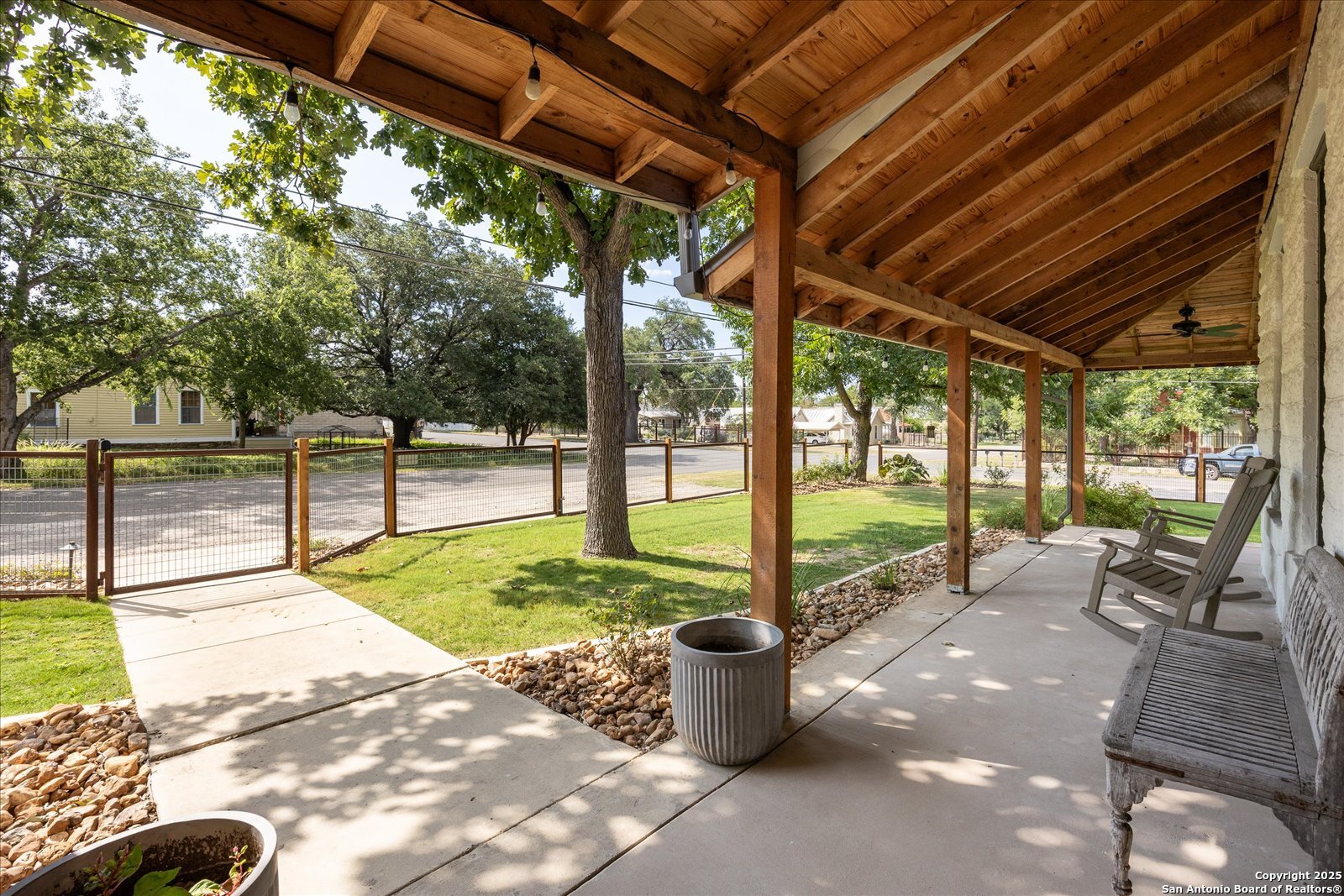504 6th Street Comfort, TX 78013 - Photo 5 of 48 a view of a patio with table and chairs next to a yard