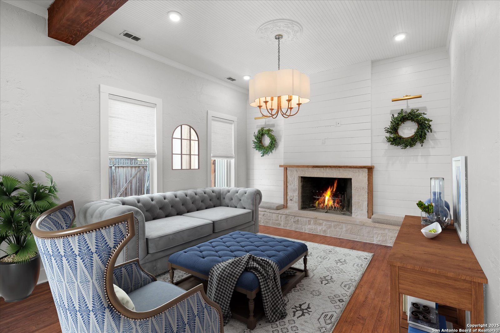 504 6th Street Comfort, TX 78013 - Photo 9 of 48 a living room with furniture a chandelier and a fireplace