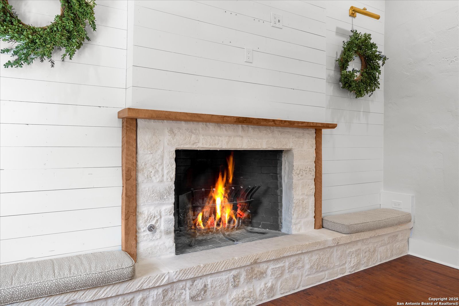 504 6th Street Comfort, TX 78013 - Photo 10 of 48 a view of an empty room with wooden floor and a fireplace