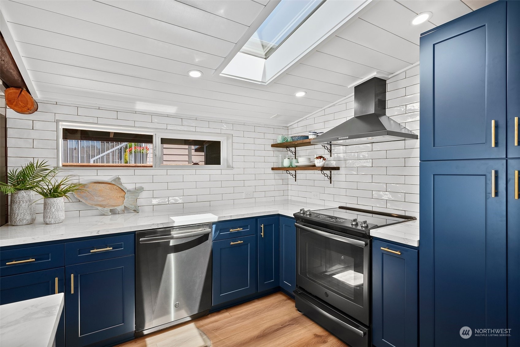 4234 Sunset Beach Road University Place, WA 98466 - Photo 12 of 40 a kitchen with a sink and stove