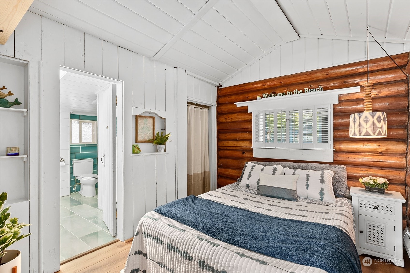 4234 Sunset Beach Road University Place, WA 98466 - Photo 16 of 40 a bedroom with a bed and a window