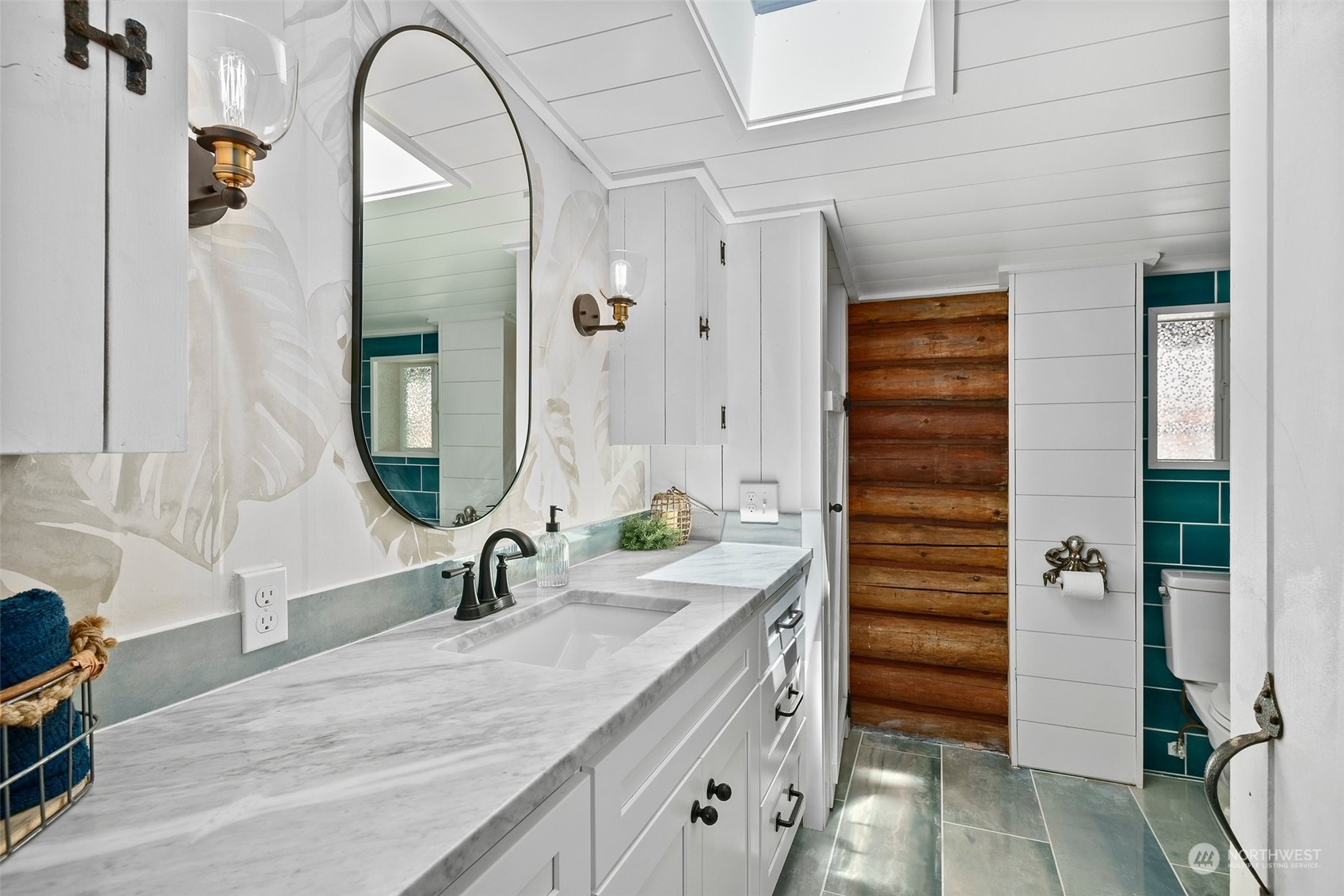 4234 Sunset Beach Road University Place, WA 98466 - Photo 17 of 40 a bathroom with a sink and a mirror