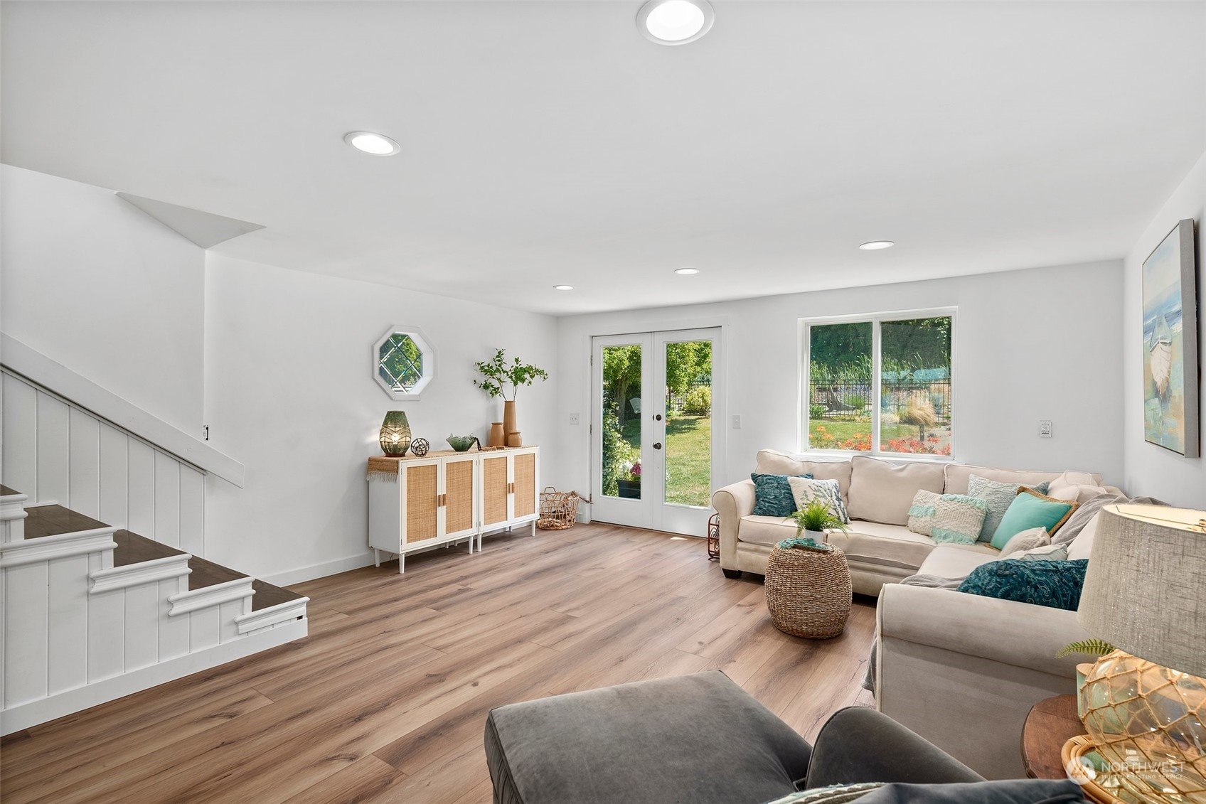 4234 Sunset Beach Road University Place, WA 98466 - Photo 20 of 40 a living room with furniture and a wooden floor