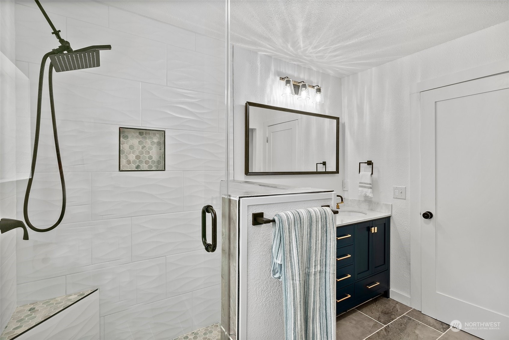 4234 Sunset Beach Road University Place, WA 98466 - Photo 29 of 40 a bathroom with a granite countertop shower a mirror and sink